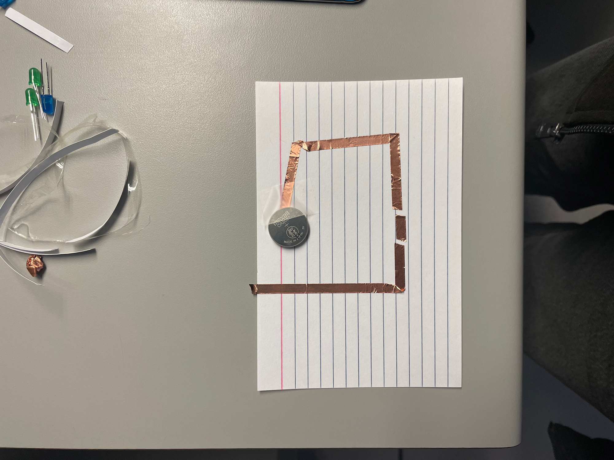 This picture captures what I learned about the batteries in my second circuit. I faced the 
                  batteries down like earlier but instead of one I used to which I learned in nessassary for
                  multiple bulbs being used but I still wonder if I can just use a bigger battery that is stronger. 
                  I will need to take the battery situation into consideration for what will be possible for my 
                  final first project.