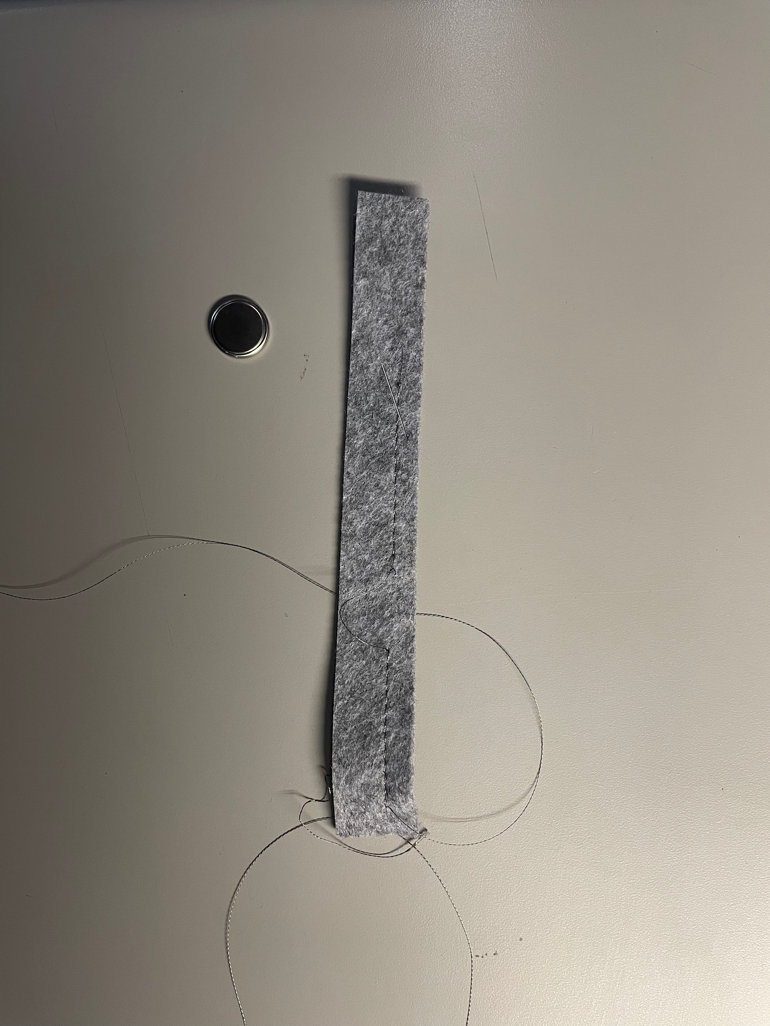 The battery caused me issues becuase it had to be held in place while also attatching thread. 
                  So, I had to save enough felt at the end because I did not plan it out properly, but now I 
                  know to get a second opinion in the future to save time and materials. I wonder if I could 
                  have used the discarded piece if I thought harder about it.